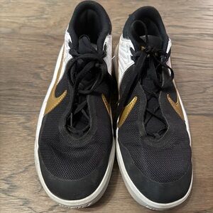 Nike Hustle DX Men's Black and Gold Athletic Shoes